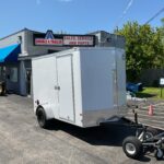 2025 AMERICAN HAULER ARROW DELUXE 6′ X 10′ WITH 6′ 6″ INTERIOR HEIGHT CARGO / ENCLOSED TRAILER
